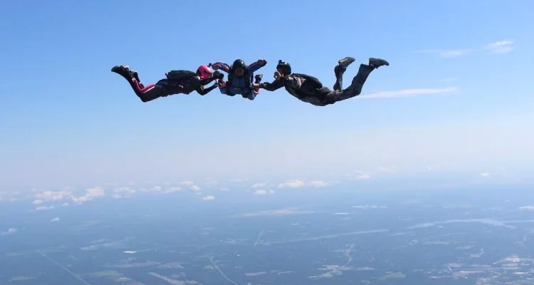 3 people sky diving over Florida